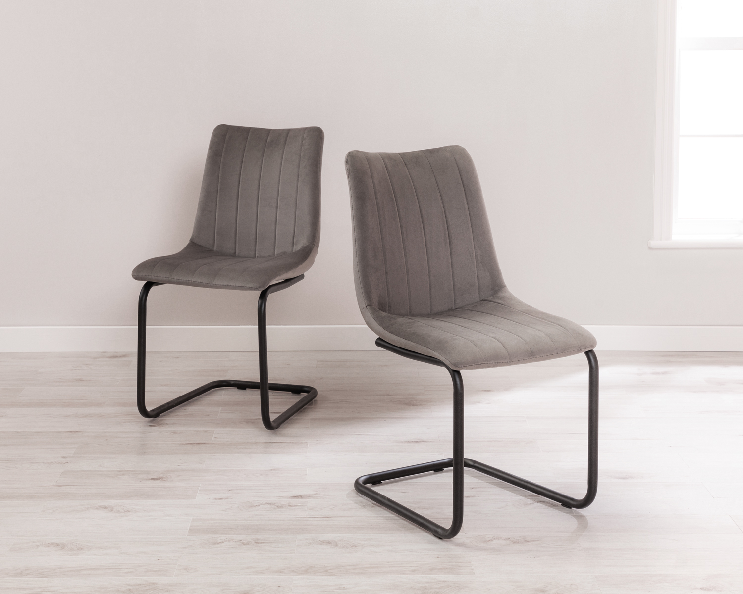 Product photograph of Pair Of Grey Velvet Dining Chairs With Black Legs - Bailey from Lifestyle Furniture